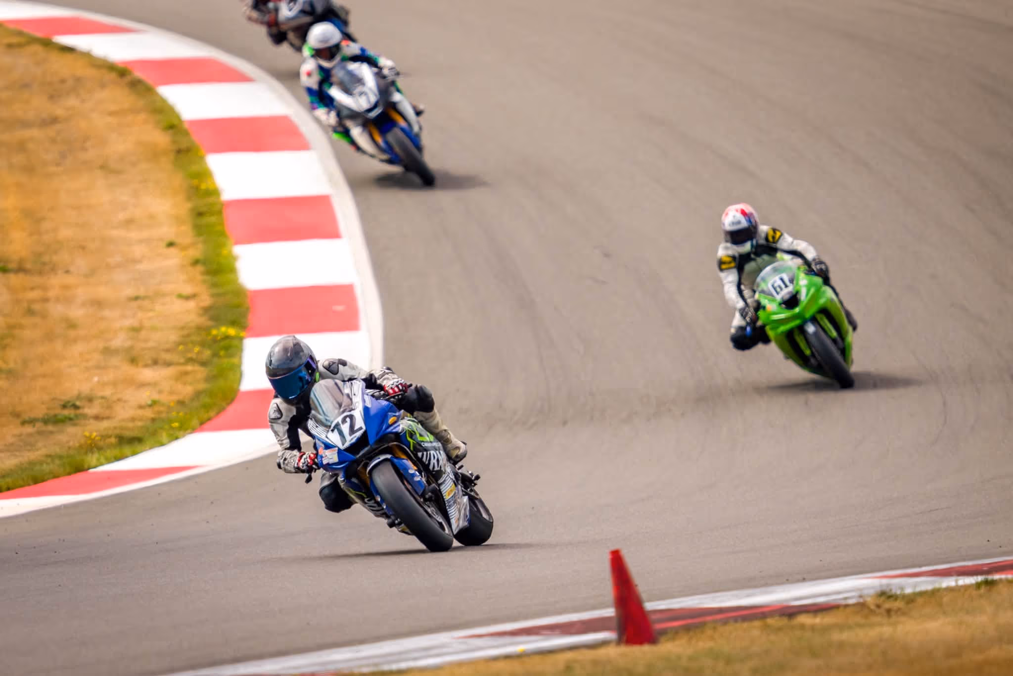 Chasing down riders through a corner